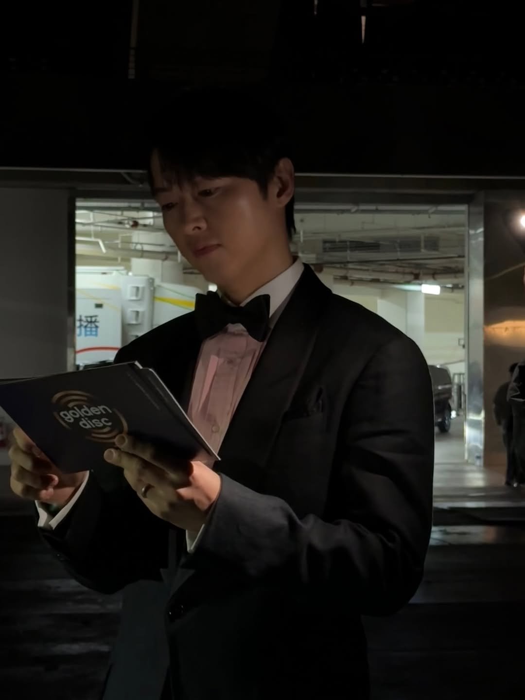 Photo by 송중기 songjoongki official on January 11, 2026. May be an image of one or more people, bolo tie, bowtie, suit, blazer, dinner jacket and text.