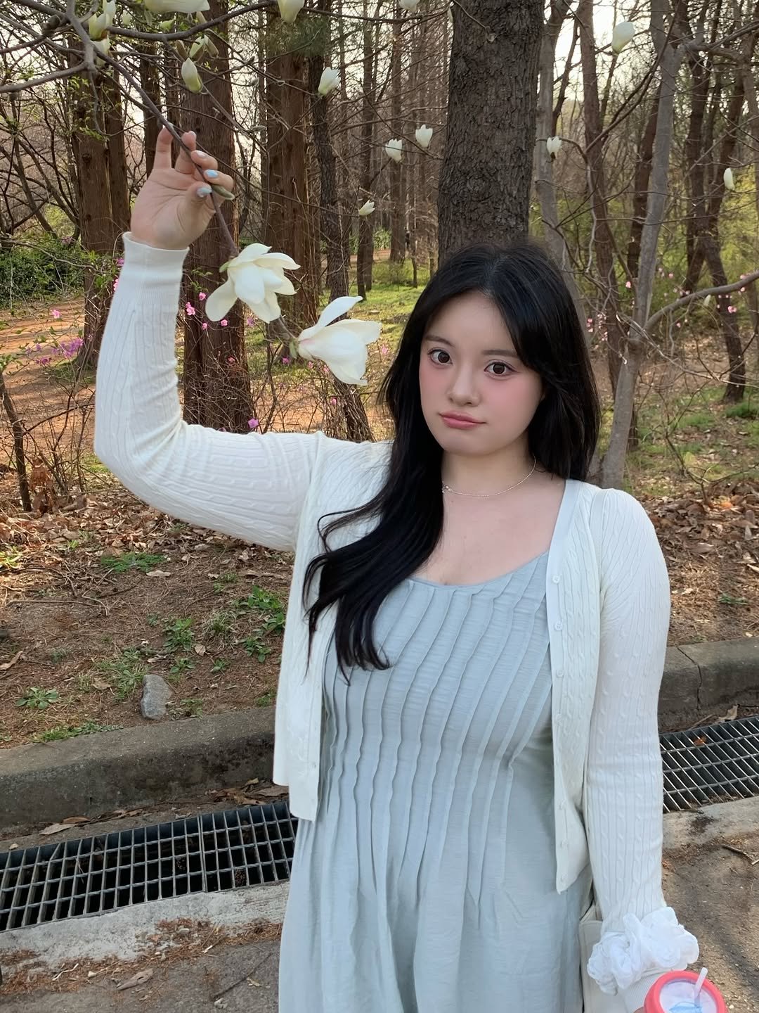 Photo by 물결 Mulgyul on April 09, 2026. May be an image of dress, white lily and text.