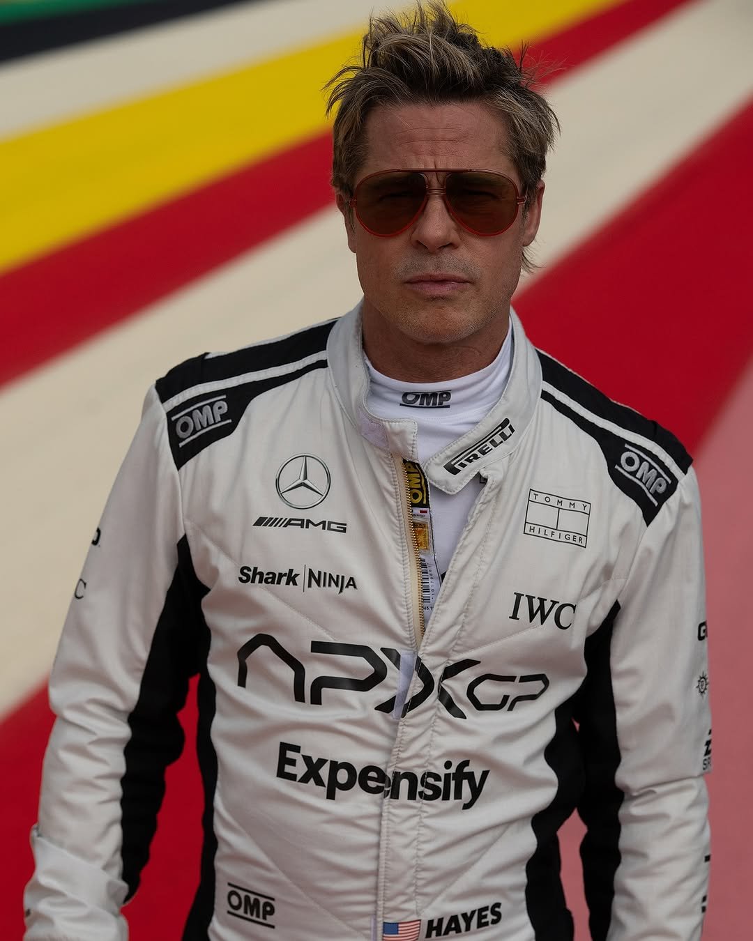 Photo by 에이치아이피 HIP on August 16, 2025. May be an image of 1 person, racing a vehicle, race car and text that says 'OMP IAMG FRELLI TRELLI TCMMT M OMO HILFIGER HILP Shark Shark|NINJA NINJA IWC PIXG Expensify HAYES'.