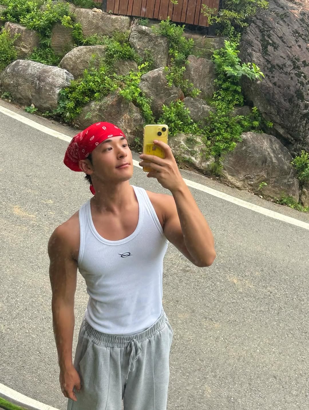 Photo by 김히릿 on August 09, 2025. May be an image of 1 person, biceps, tanktop, bandanna, headscarf, outdoors and text.
