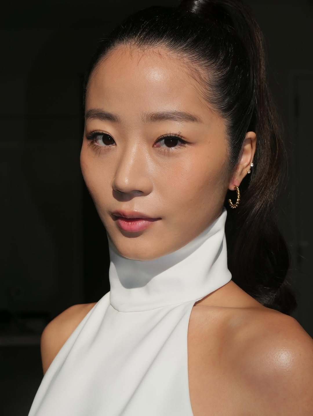 Photo by Evelyn 현정 Ha on February 15, 2026. May be a closeup of one or more people, makeup, hair, turtleneck and text.