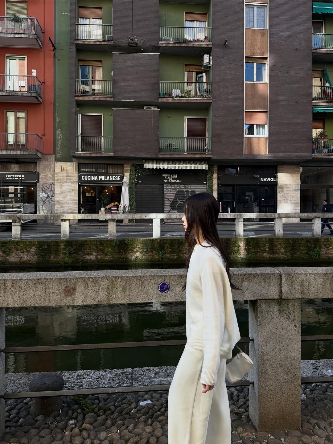 Photo by Evelyn 현정 Ha on February 21, 2026. May be an image of overcoat, street and text.