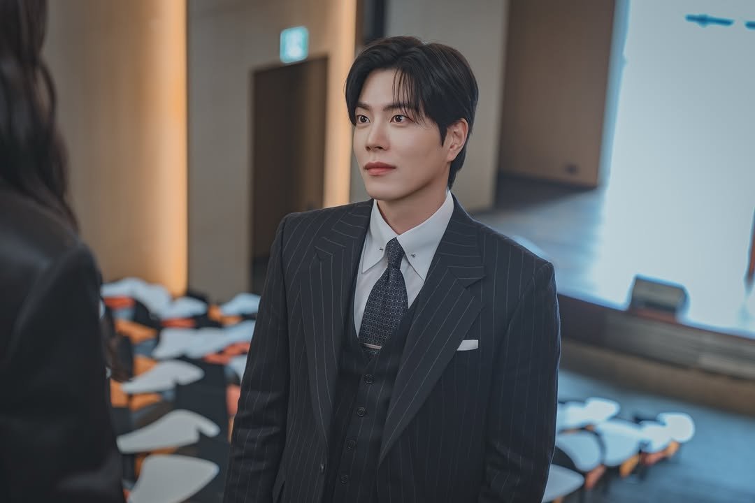 Photo shared by 홍종현 on November 27, 2025 tagging @tving.official. May be an image of one or more people, suit, blazer, dinner jacket, bolo tie and text.