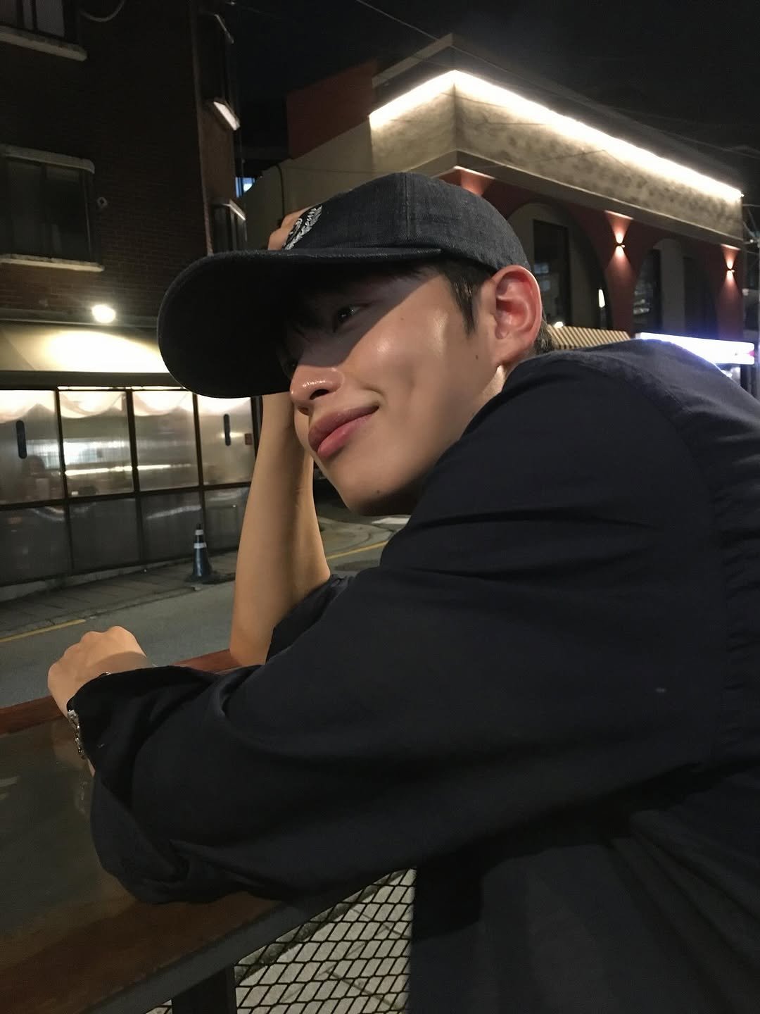 Photo by 정호균 on August 29, 2025. May be an image of 1 person, hat, night and text.