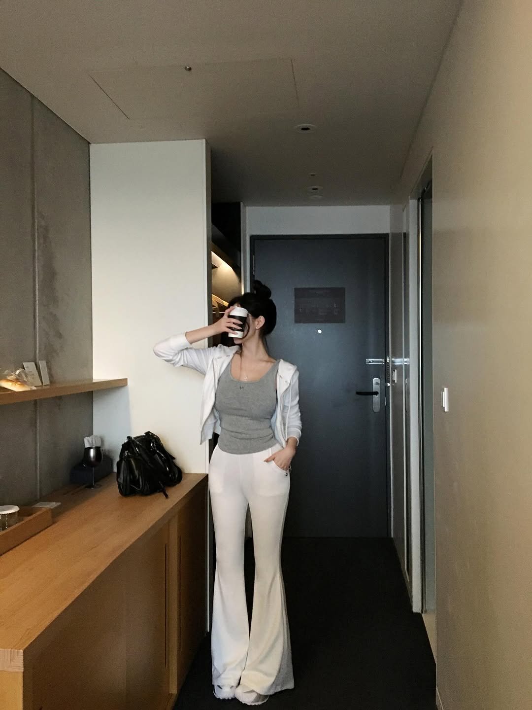 Photo by (주)홀리 on January 12, 2026. May be an image of jumpsuit, suit and text.