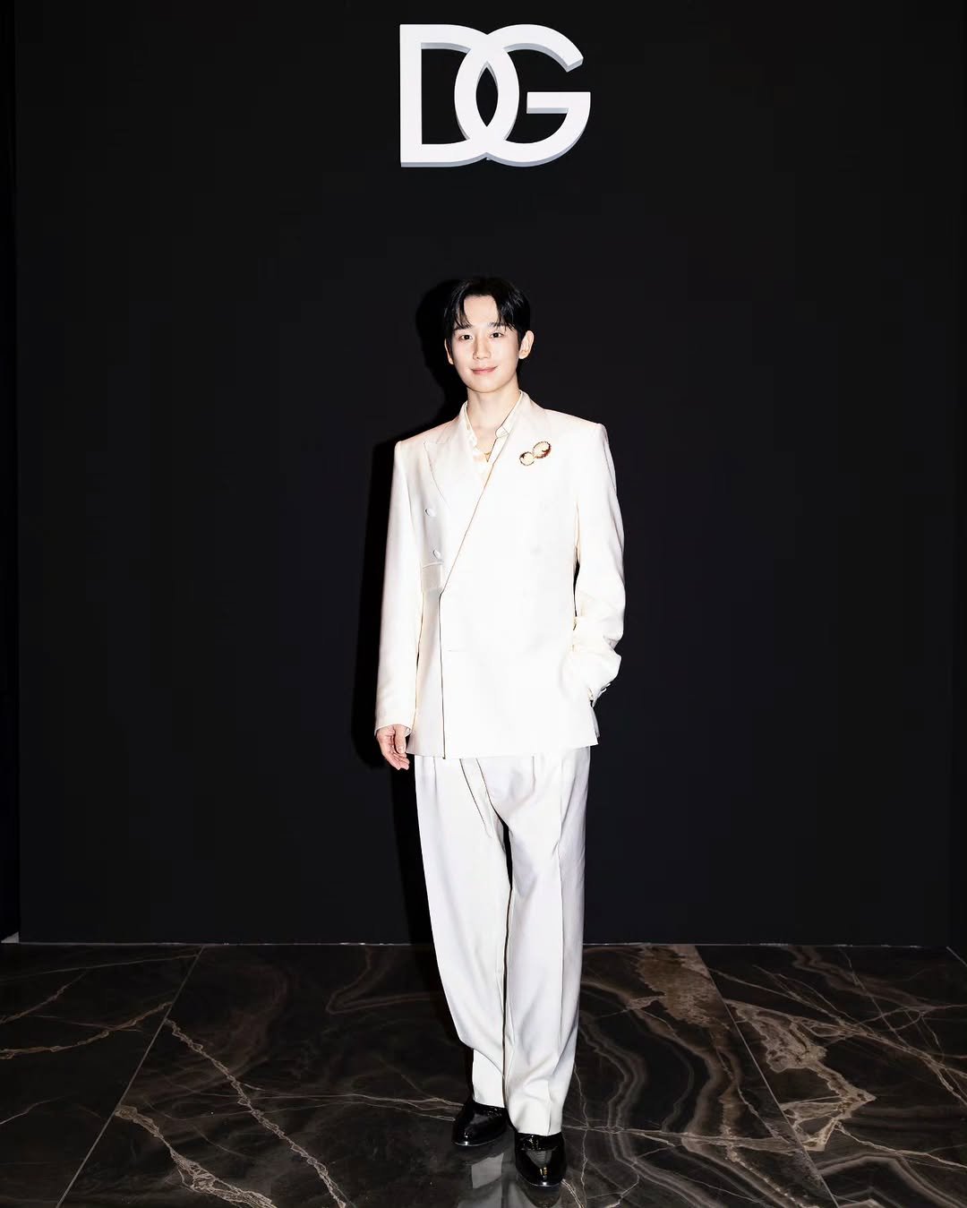 Photo by 정해인 on January 19, 2026. May be an image of one or more people, bangs, suit, top, dinner jacket, bolo tie and text that says 'D'.