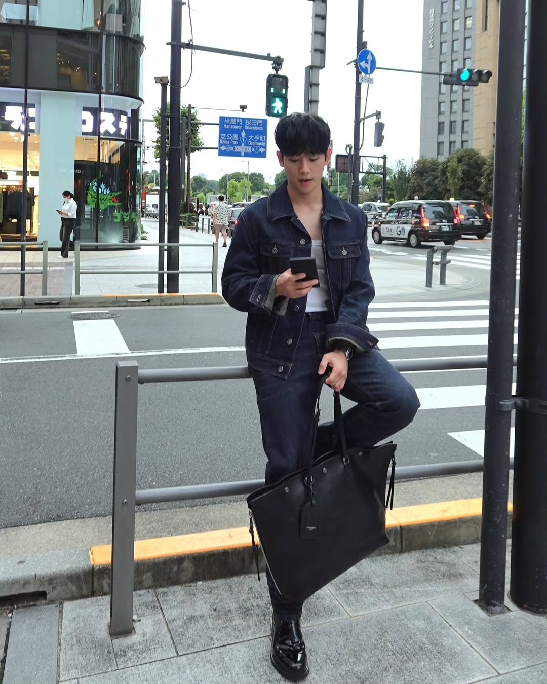 Photo shared by 정해인 on September 25, 2025 tagging @dolcegabbana. May be an image of military uniform, briefcase and text.