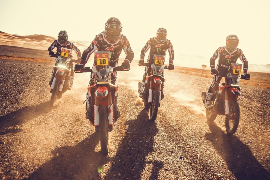 Photo shared by Honda HRC on January 01, 2026 tagging @dakarrally, @rallyteamhrc, @hondamotosbr, @hondaracingbr, and @officialw2rc. May be an image of racing vehicles, dirt bike, motorcycle, all-terain vehicle, helmet, scooter and text that says 'e 10 NOTUL 42 MOTal M HON A 68 VUNUI'.
