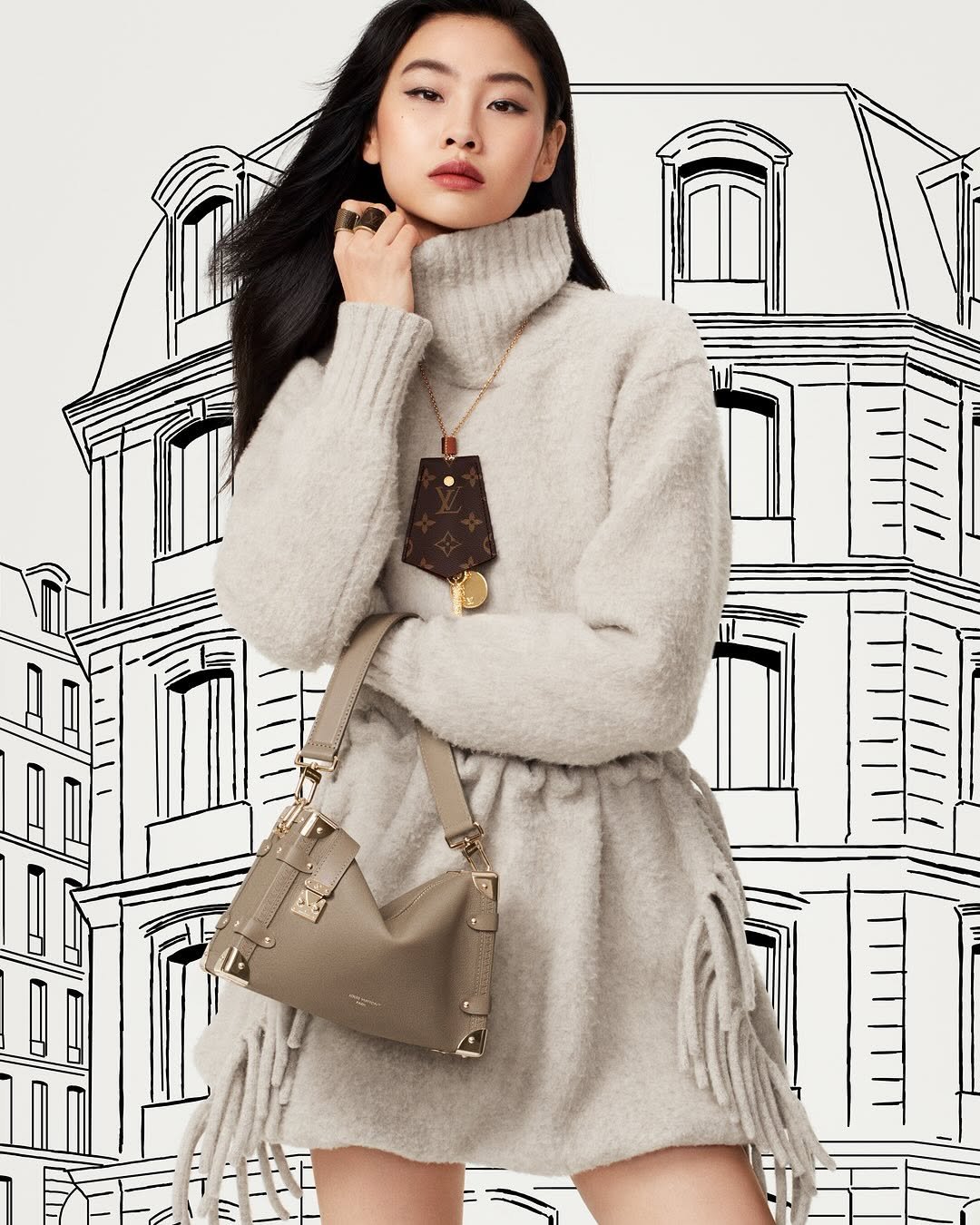 Photo shared by Louis Vuitton on October 09, 2025 tagging @hoooooyeony, and @nicolasghesquiere. May be an image of 1 person, duffle coat, goosedown coat, fur coat, purse, turtleneck and text.