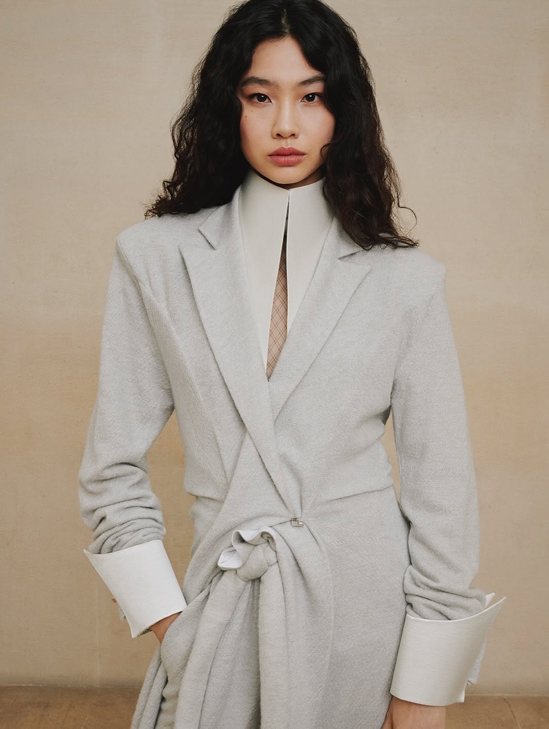 Photo shared by Hoyeon on October 02, 2025 tagging @patmcgrathreal, @louisvuitton, @marieameliesauve, @duffy_duffy, @florentbuono, @ashleybrokaw, and @nicolasghesquiere. May be an image of 1 person, duffle coat, overcoat, suit, blazer and text.