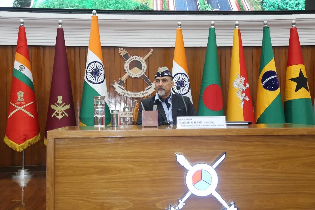 Photo by HQ IDS India Official Account on February 13, 2026. May be an image of flag, dais and text.