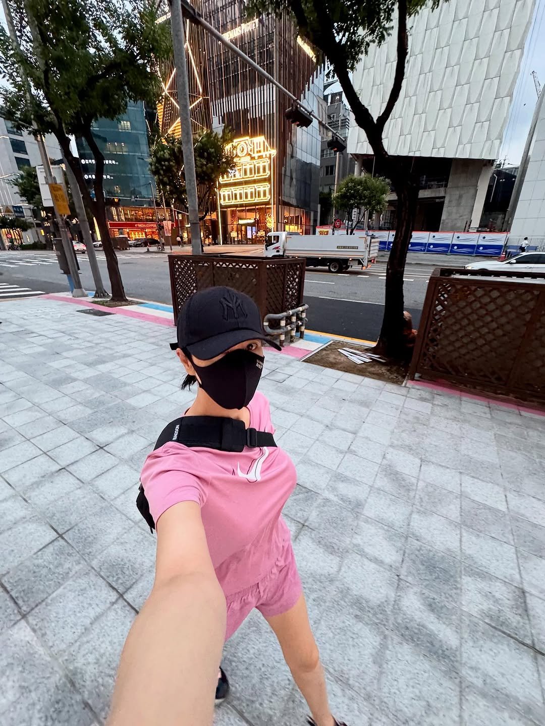 Photo by 김혜수 Hye Soo Kim on August 30, 2025. May be an image of 1 person, shorts, street and text.