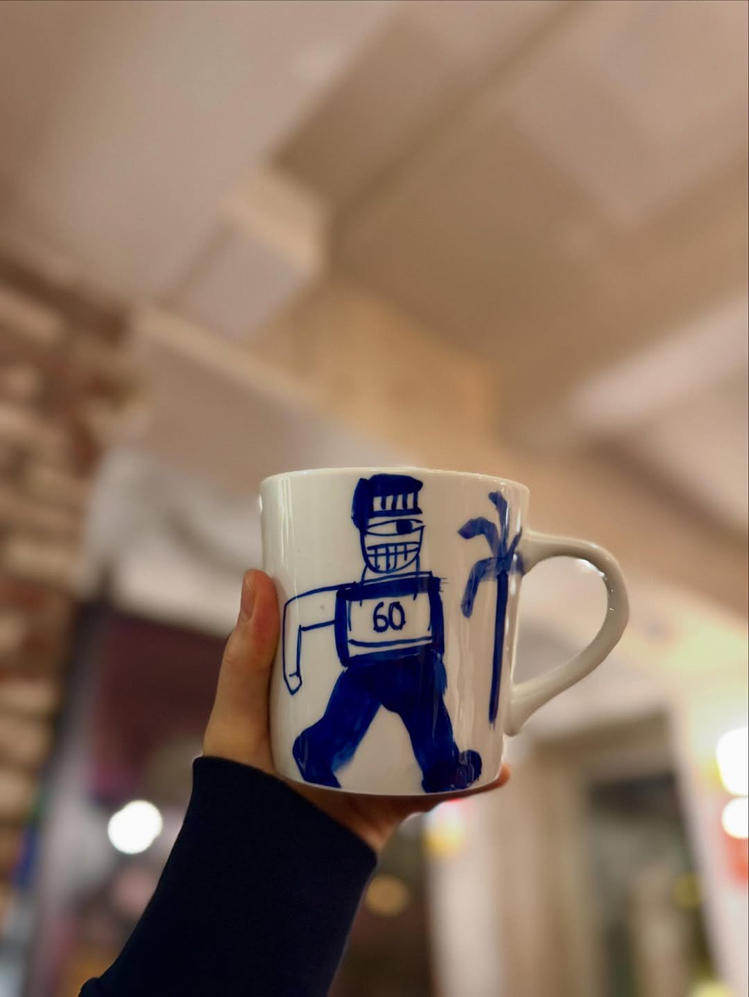 Photo by 김혜수 Hye Soo Kim on October 31, 2025. May be an image of coffee cup, cup, mug, teacup, pottery, cornflower and text.