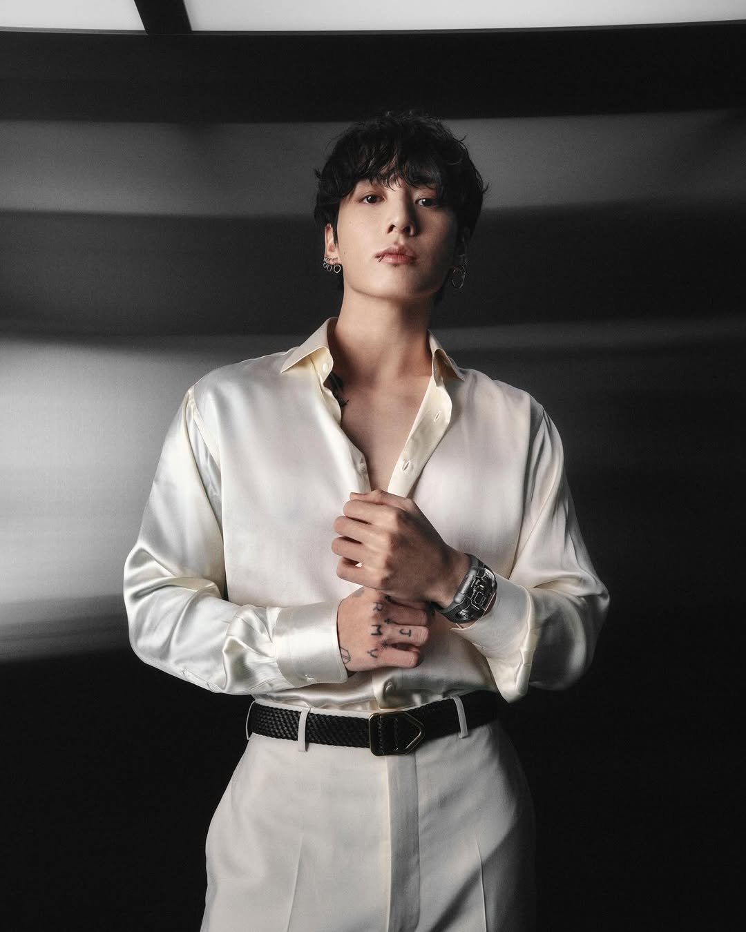 Photo shared by Hublot on April 02, 2026 tagging @mnijungkook. May be an image of bolo tie and text.