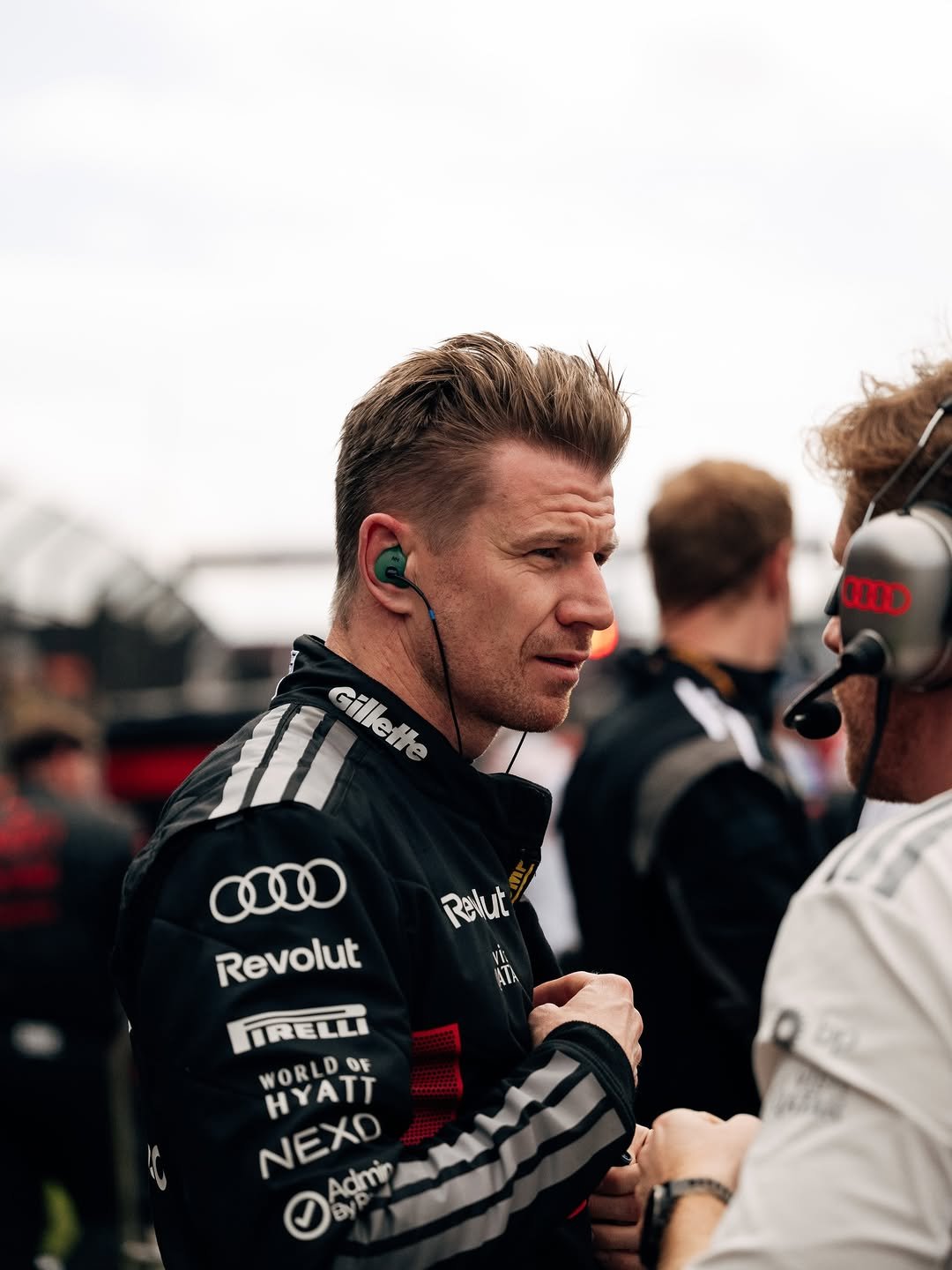 Photo shared by Nico Hulkenberg on March 08, 2026 tagging @f1, and @audif1. May be an image of racing vehicles, helmet and text that says 'OD M Cilesina Gillette Relut vi. ATA Revolut IRELLI WORLDOF OF HYATT NEXD Adui Admi'.