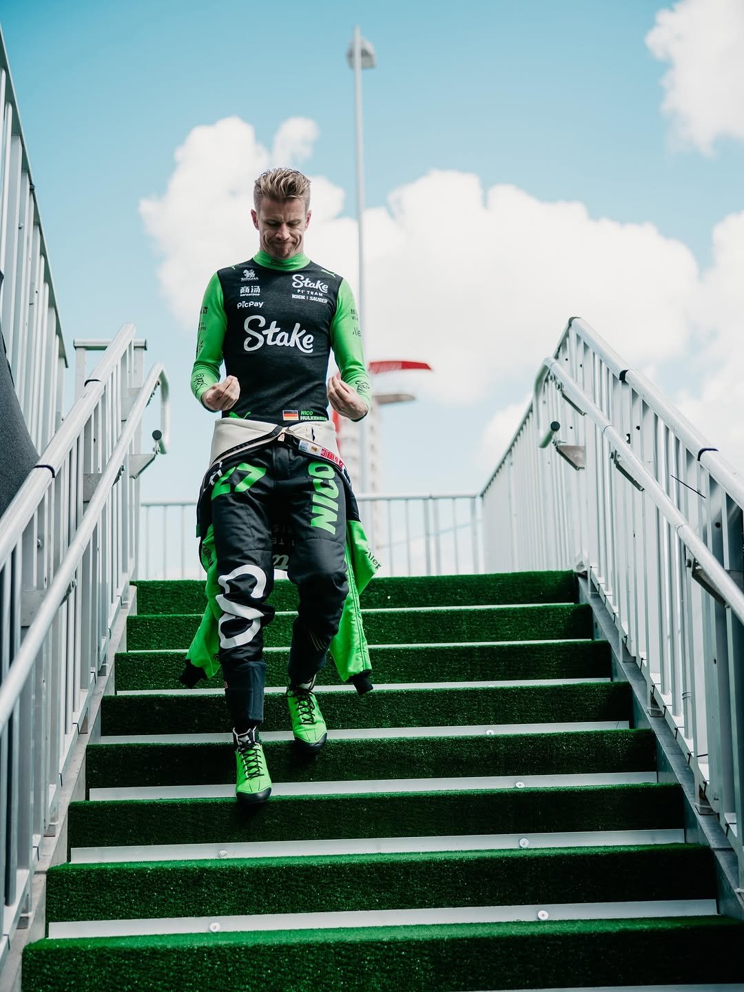 Photo shared by Nico Hulkenberg on October 20, 2025 tagging @stakef1team, and @f1. May be an image of racing vehicles, sportswear, stadium and text.