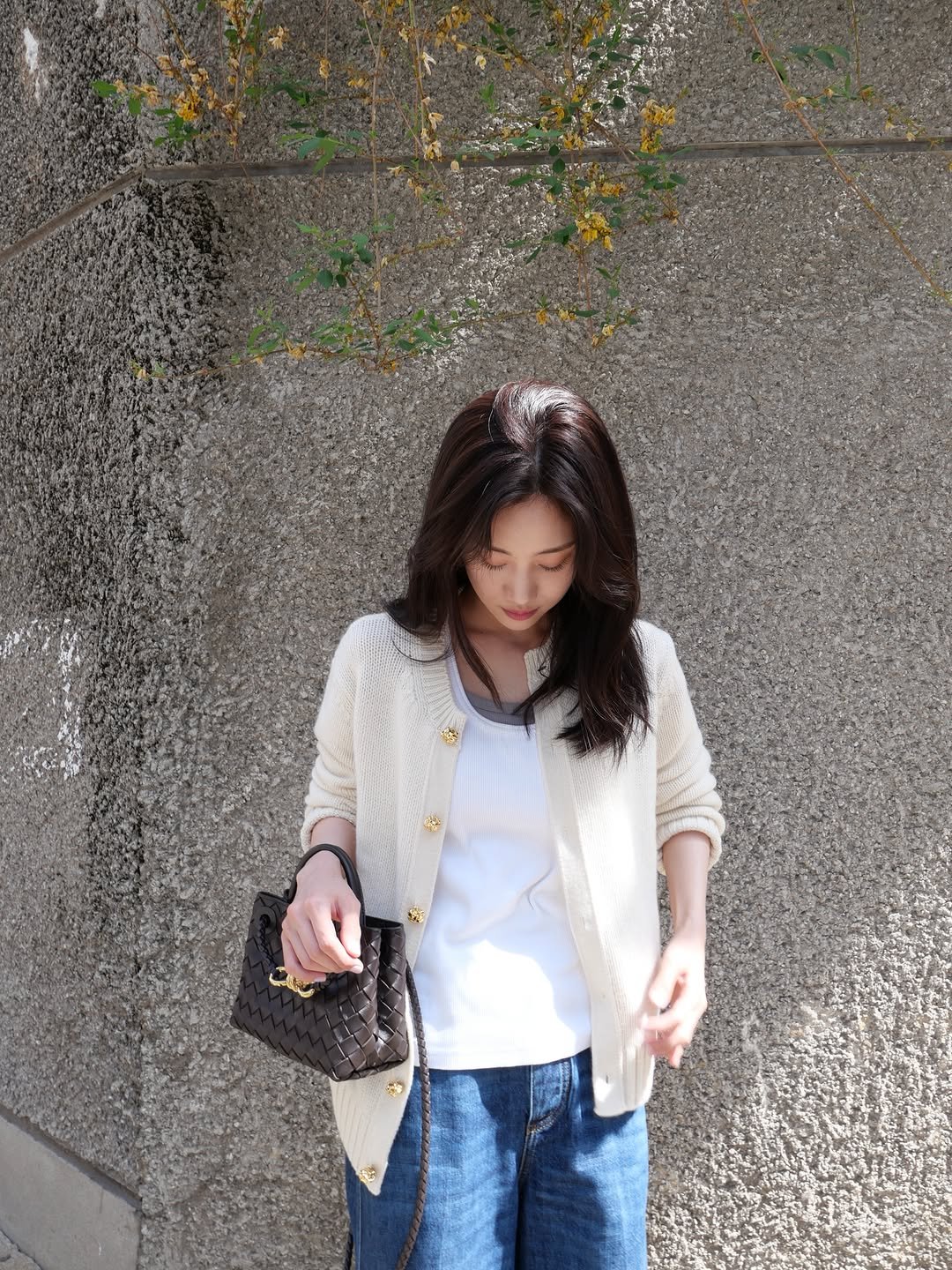 Photo shared by 홍화연 ••• Hong Hwayeon on April 27, 2026 tagging @newbottega. May be an image of cardigan and text.