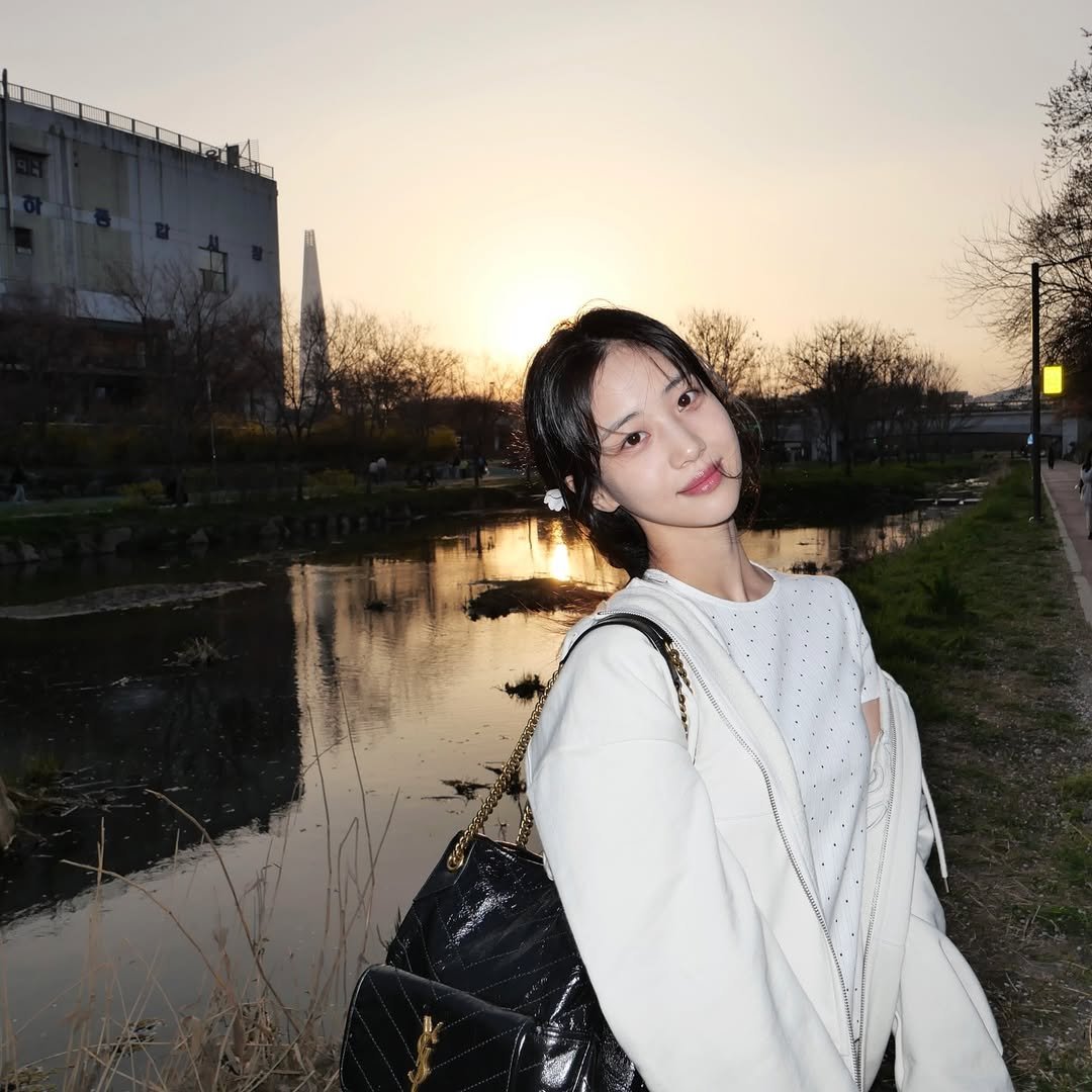 Photo shared by 홍화연 ••• Hong Hwayeon on April 05, 2026 tagging @ysl. May be an image of one or more people, hair, outdoors and text.