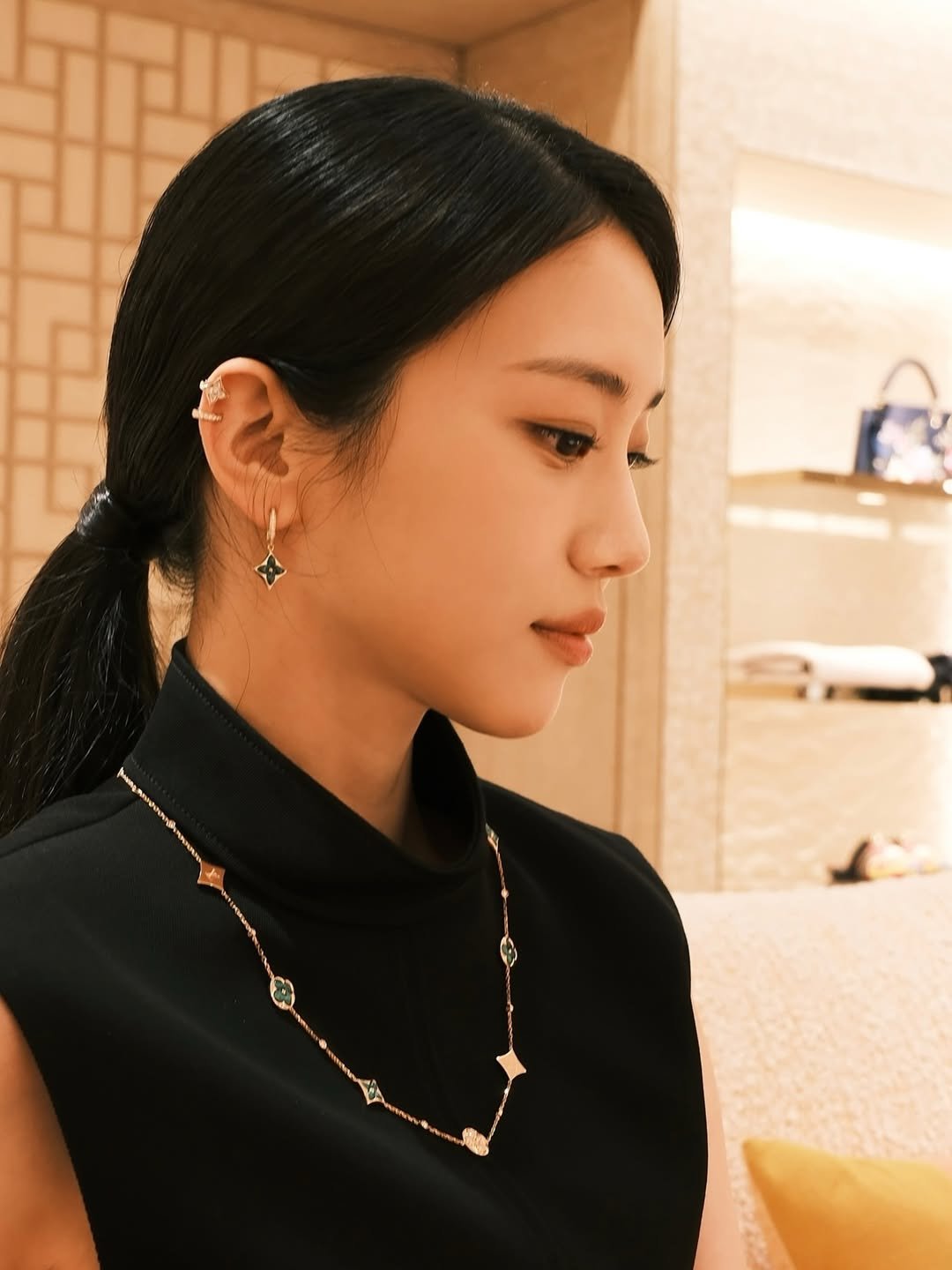 Photo shared by 홍화연 ••• Hong Hwayeon on March 31, 2026 tagging @louisvuitton. May be an image of turtleneck, necklace, bolo tie and text.