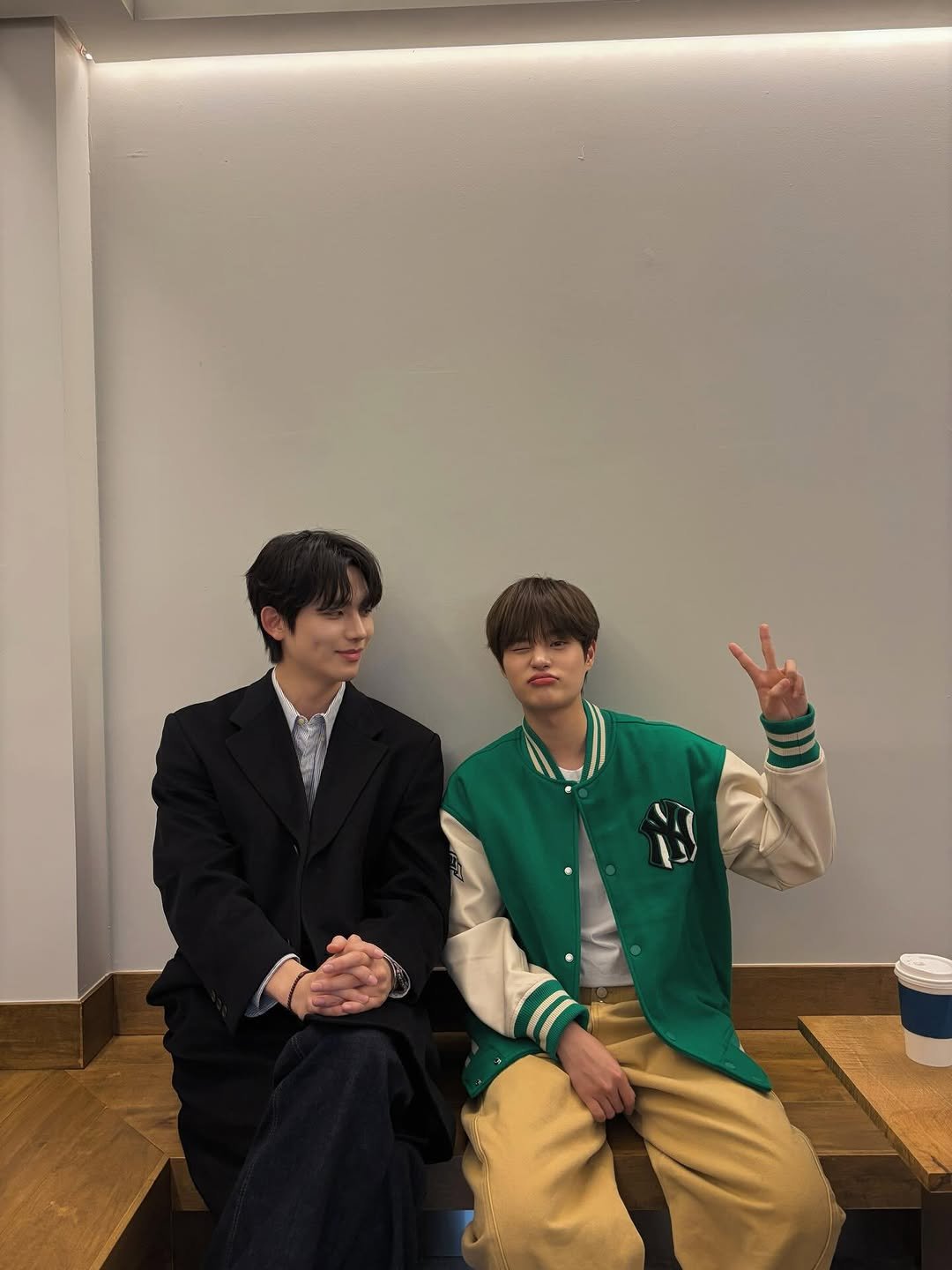 Photo shared by 윤현제 YOUN HYUNJAE on March 11, 2026 tagging @hwisosik. May be an image of one or more people, duffle coat and text.