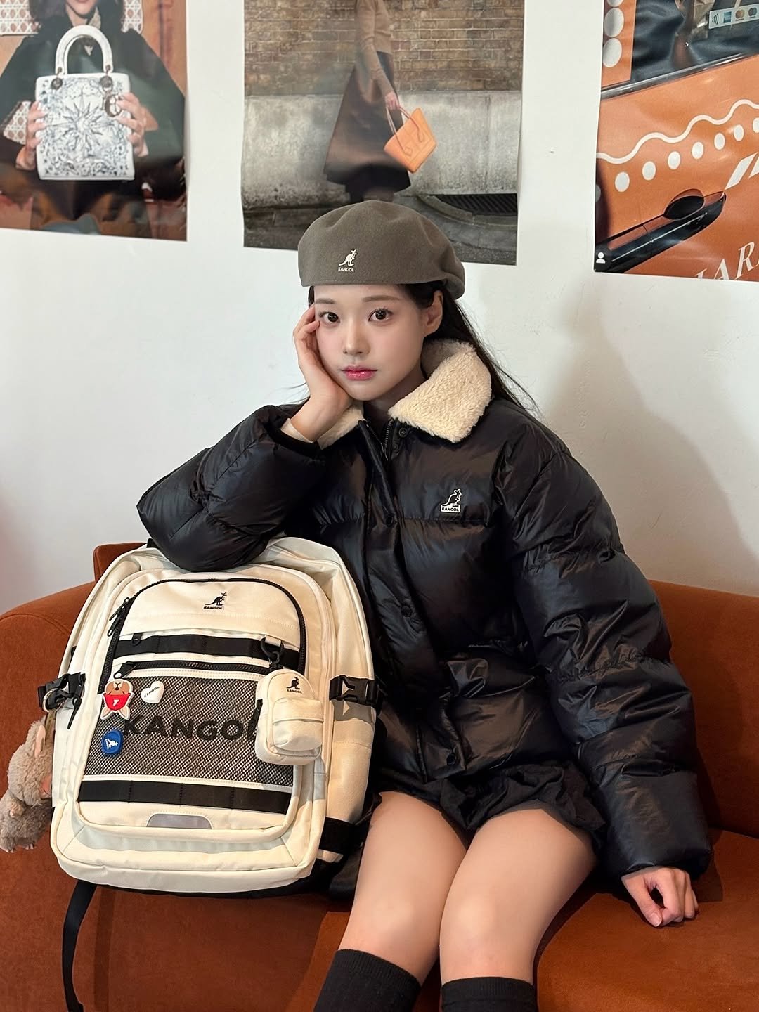Photo shared by 조효민 on November 30, 2025 tagging @kangolkorea. May be an image of duffle coat, hat, goosedown coat, sling, flight jacket, parka and text.