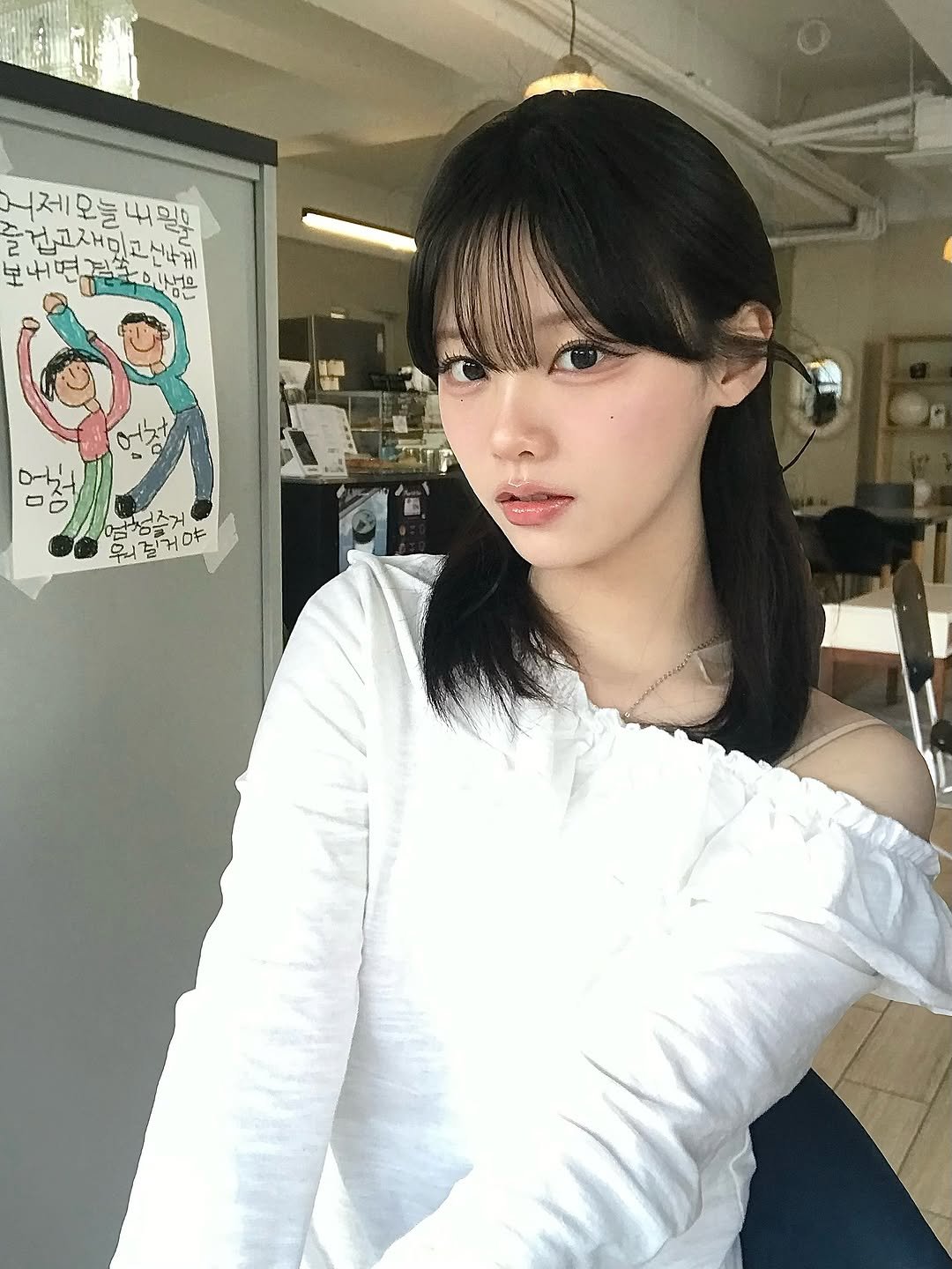 Photo by 뭐혜연 on March 14, 2026. May be an image of one or more people, bangs, makeup, top, cornflower and text.