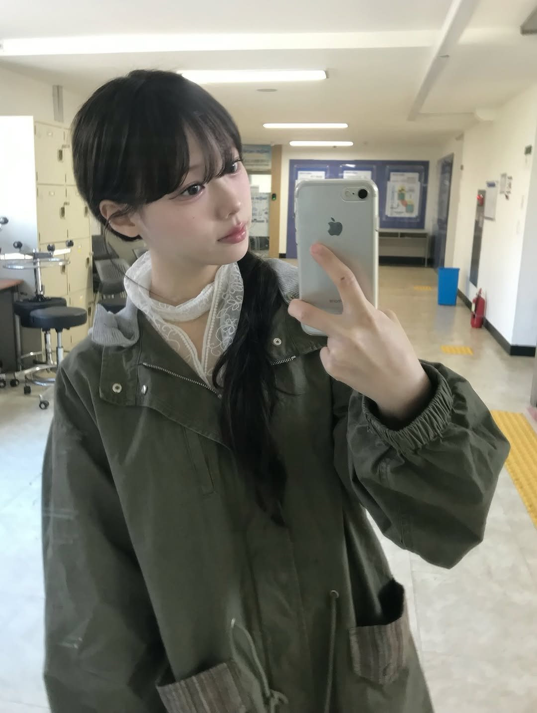 Photo shared by 뭐혜연 on April 08, 2026 tagging @aeae_official. May be a selfie of one or more people, bangs, duffle coat, parka, jacket, mirror and text.