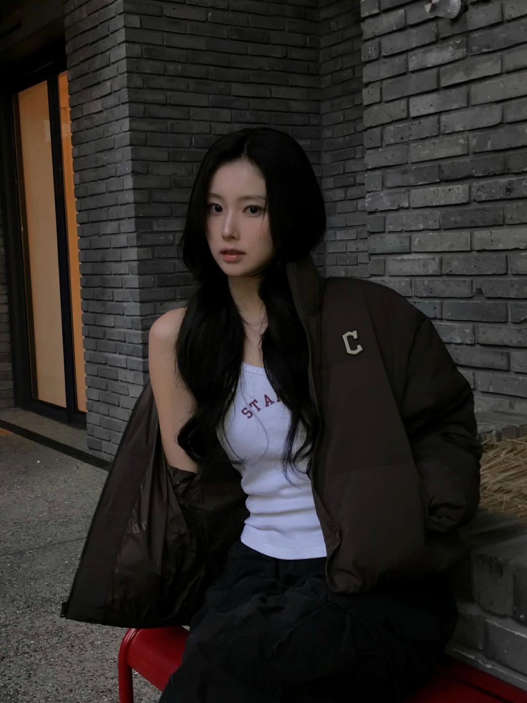 Photo shared by 강혜원 Kang hyewon on November 04, 2025 tagging @mlbkorea. May be an image of one or more people, hair, duffle coat, goosedown coat, flight jacket, top, parka and text.