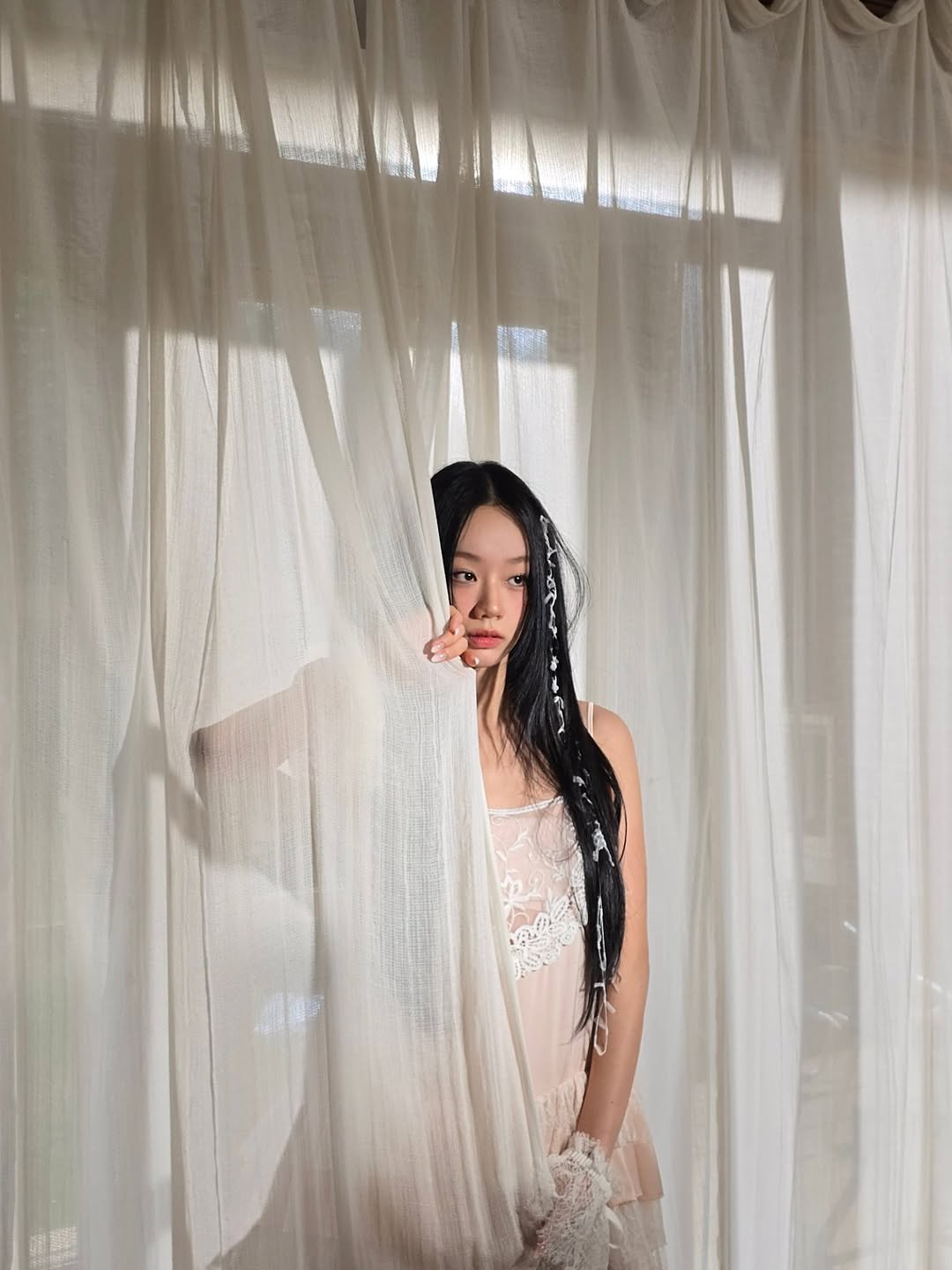 Photo by 혜리| HYERI on October 30, 2025. May be an image of one or more people, braids, slip, sleepwear and mosquito net.
