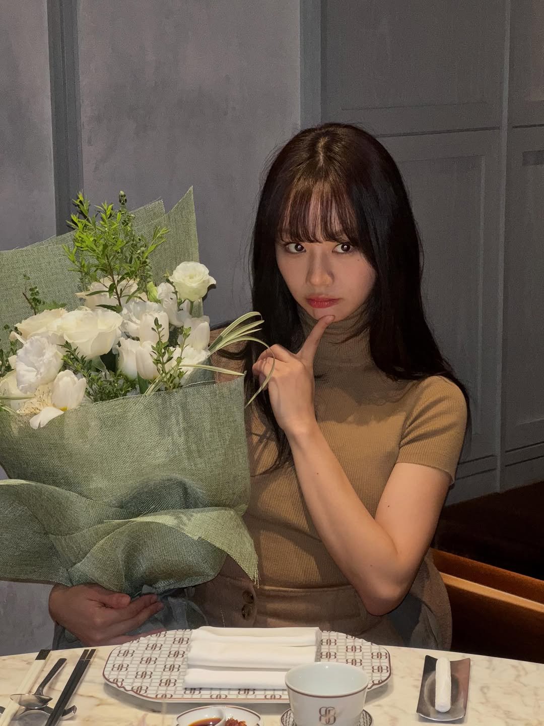 Photo shared by 혜리 on November 05, 2025 tagging @maxmara. May be an image of white lily and text.