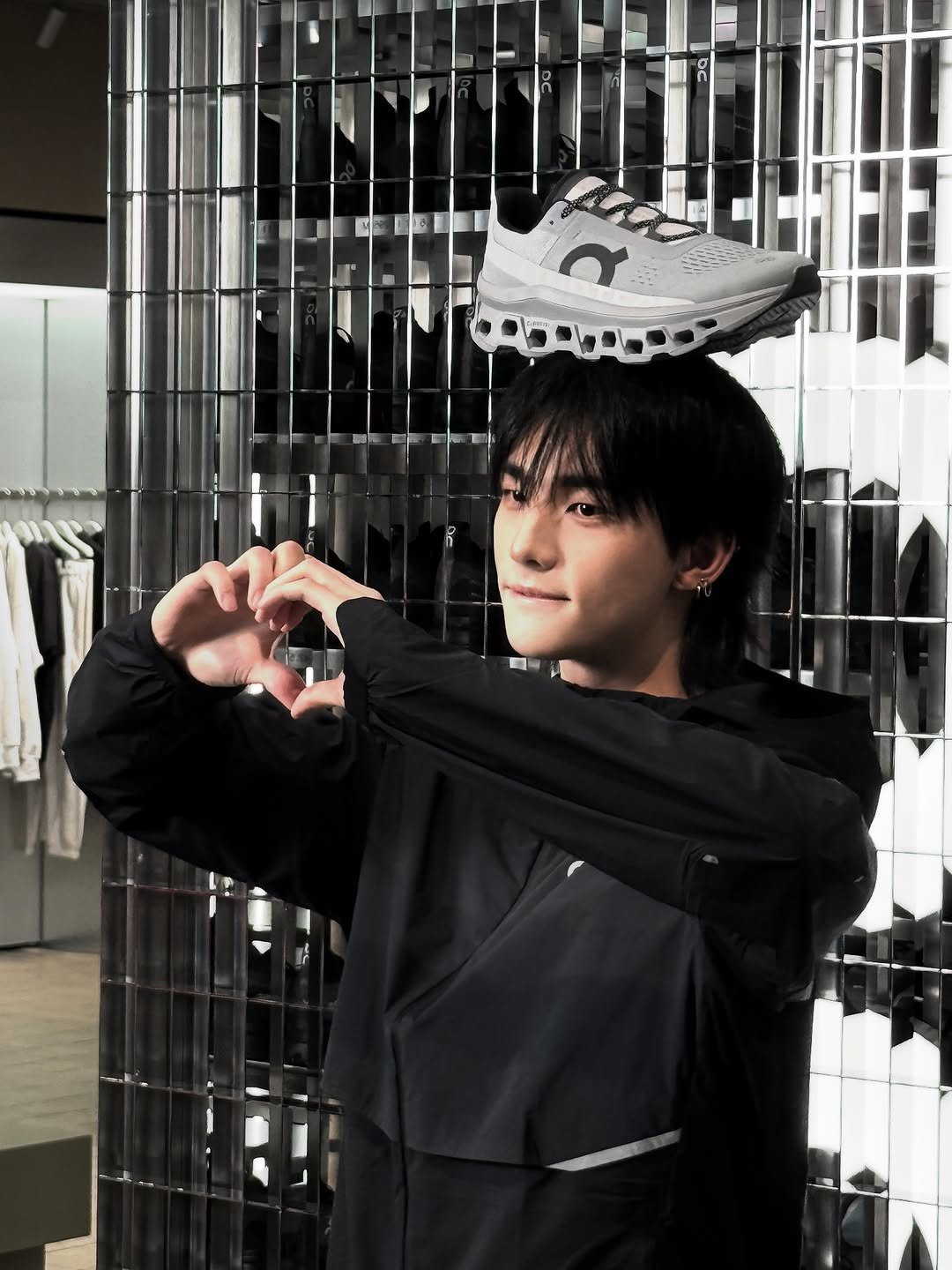 Photo by hyunjin on November 06, 2025. May be an image of one or more people, bangs, sportswear and text.