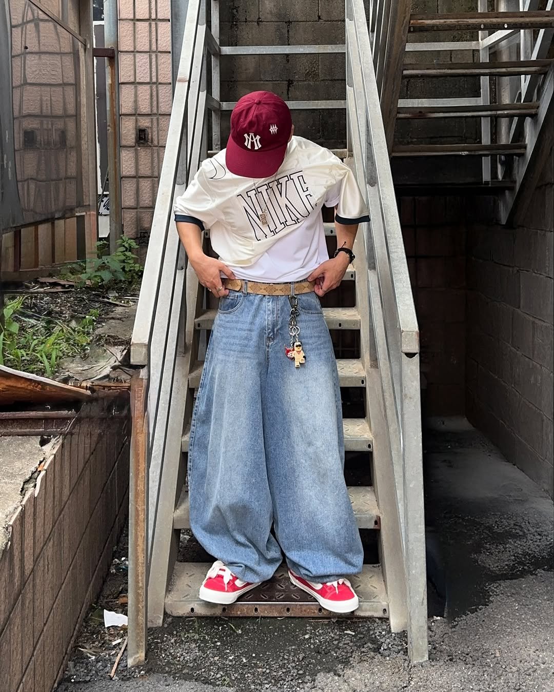 Photo shared by 황혁 on July 11, 2025 tagging @vans_korea, @noirer_official, and @not4nerd. May be an image of 1 person, fire escape, bandanna and text.