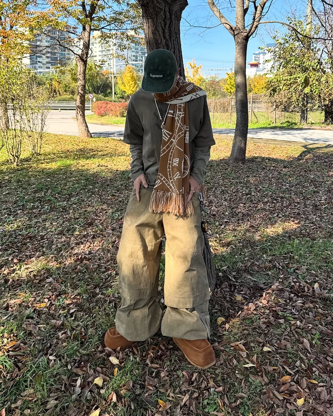 Photo by 황혁 on November 17, 2025. May be an image of standing, scarecrow, tree and text.