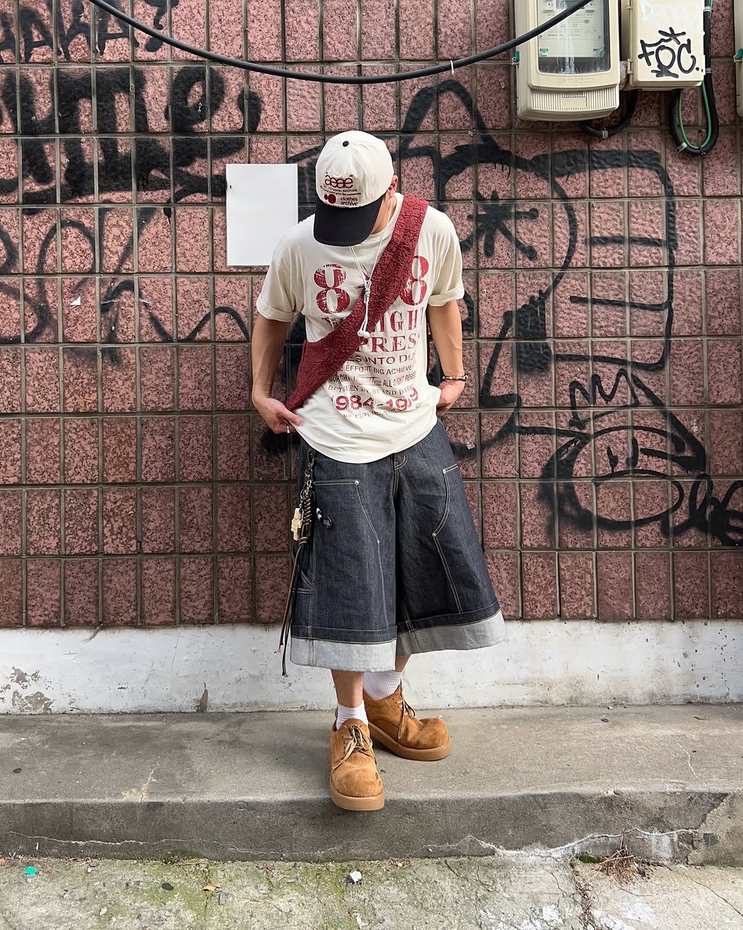 Photo shared by 황혁 on October 13, 2025 tagging @grailz_official, @idws_official, and @koinseoul. May be an image of shorts, kilt, bandanna and text.