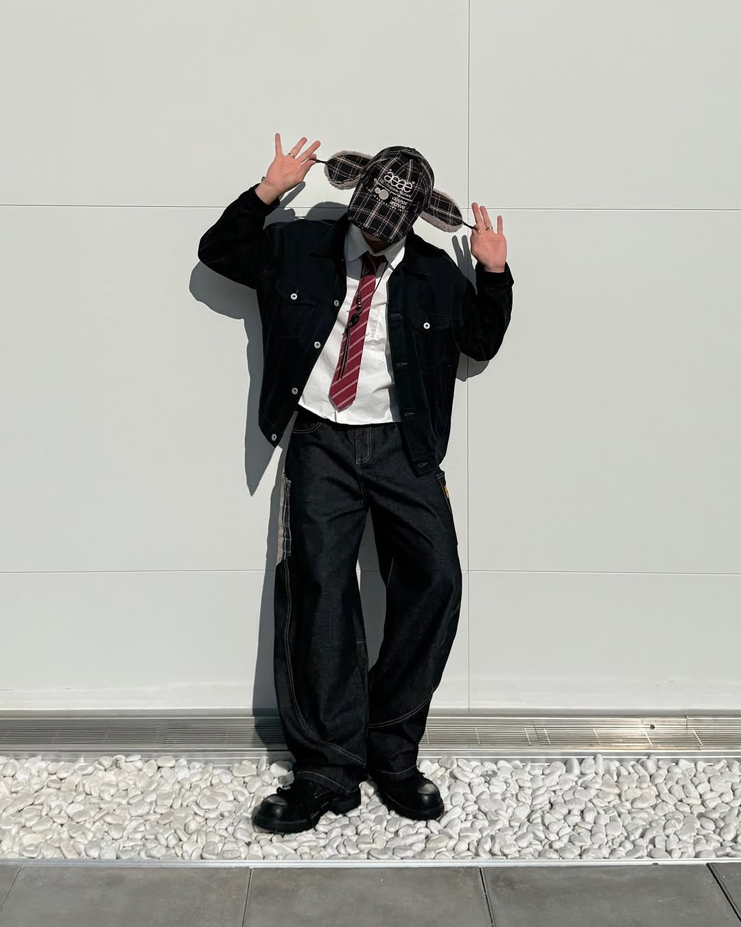 Photo shared by 황혁 on December 02, 2025 tagging @aeae_official. May be an image of wingtip shoes, suit, glasses, bowler hat and gas mask.