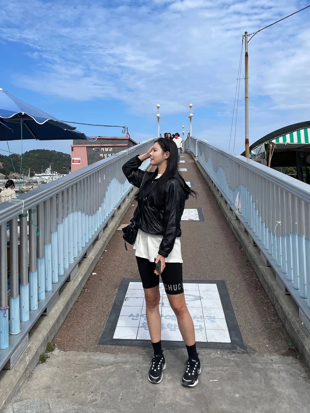 Photo by 주현하 on April 13, 2026. May be an image of miniskirt, fishnet stockings and text.