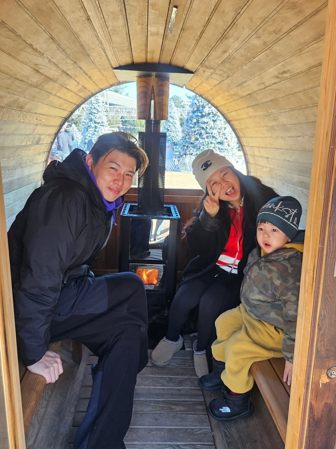 Photo shared by 홍현희 on December 25, 2025 tagging @im_jasson. May be an image of fire tower, snowsuit and text.