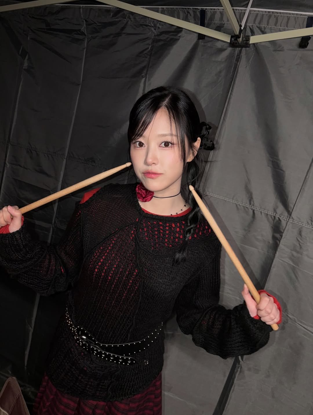 Photo by 현진 on January 08, 2026. May be an image of one or more people, mallet, drumstick, parasol, umbrella, kilt and tambourine.