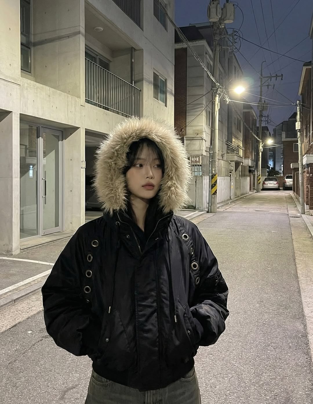 Photo shared by 세연 Seyeon🐶 on January 20, 2026 tagging @fancyclub_official. May be an image of duffle coat, overcoat, goosedown coat, fur, flight jacket, parka, street and text.