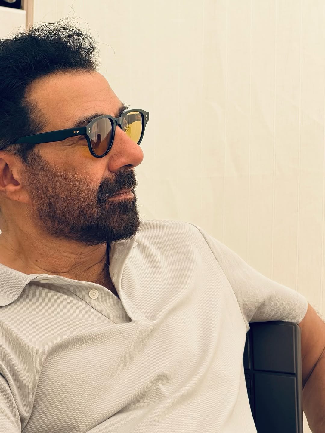 Photo by Sunny Deol on April 24, 2026. May be an image of one or more people, beard, deck chair, sunglasses and text.