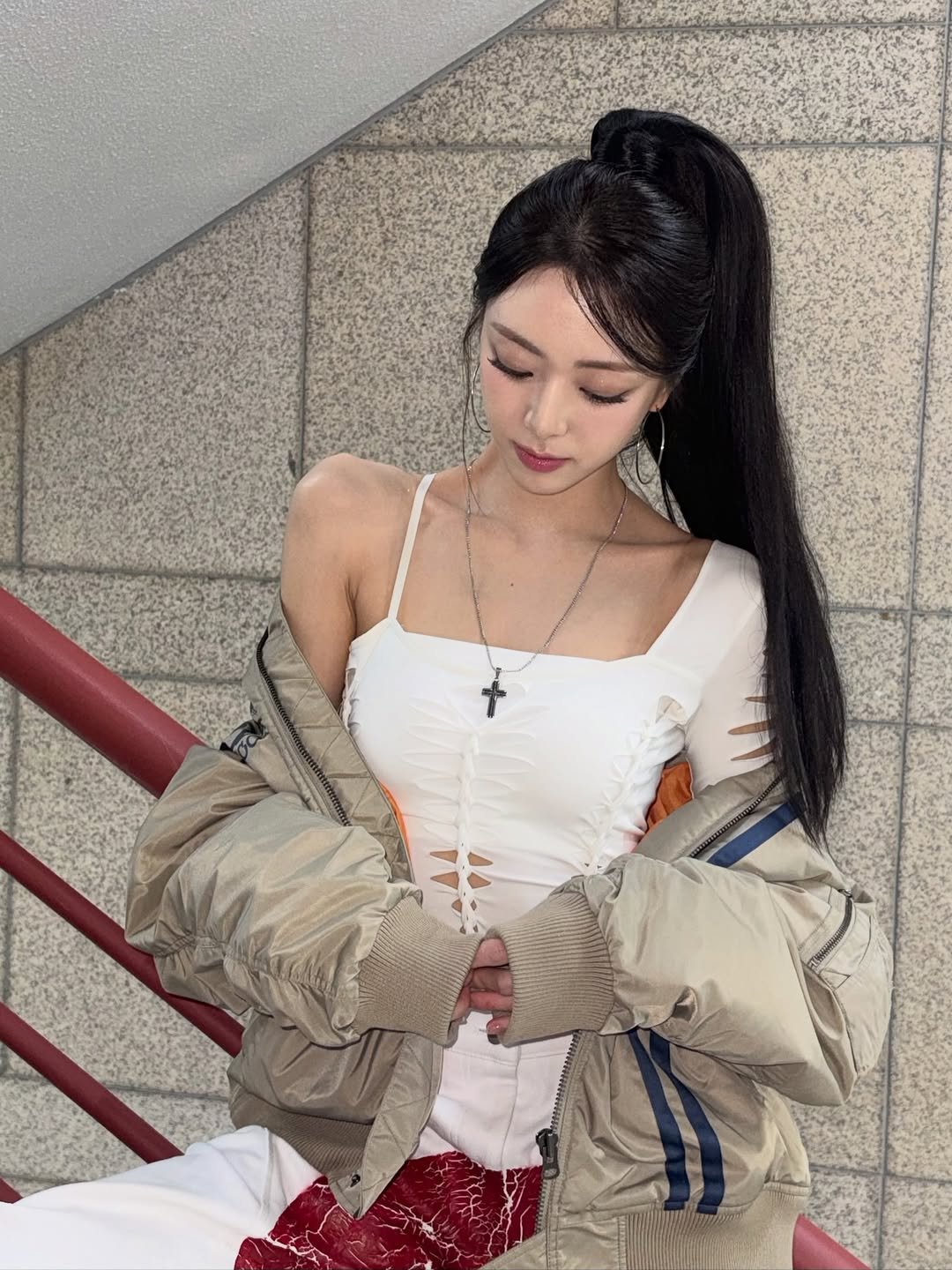 Photo by YUNA on November 23, 2025. May be an image of one or more people, hair, top, parka, jacket and text.