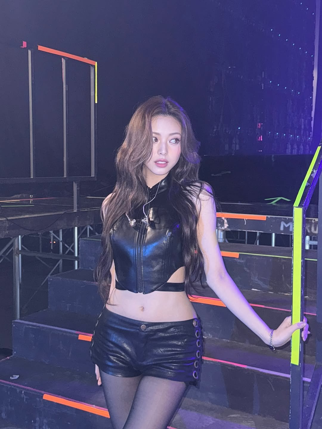 Photo by YUNA on August 30, 2025. May be an image of 1 person, miniskirt, top, fishnet stockings and text.
