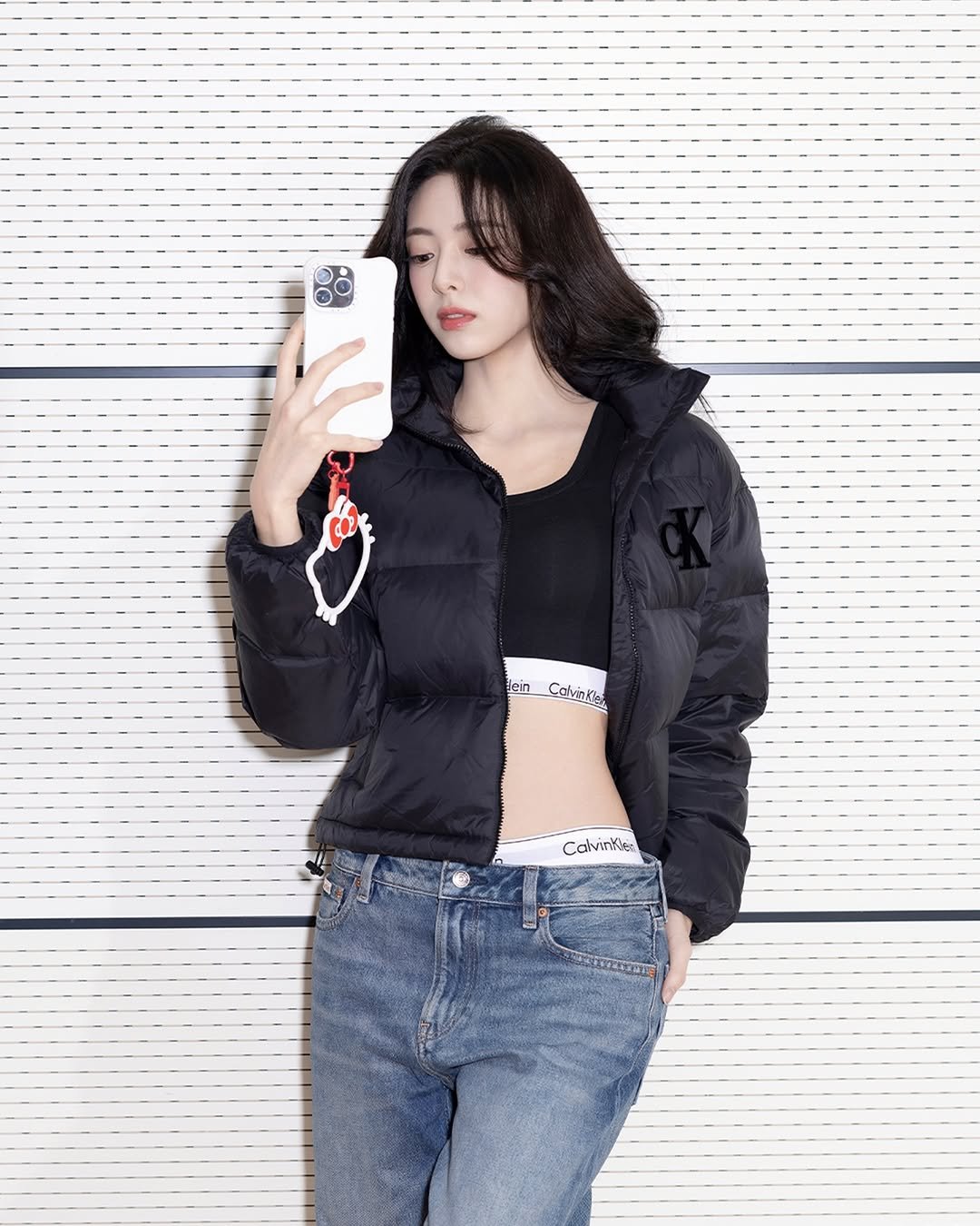 Photo shared by YUNA on December 12, 2025 tagging @calvinklein, and @itzy.all.in.us. May be an image of top, parka, coat, flight jacket and text.