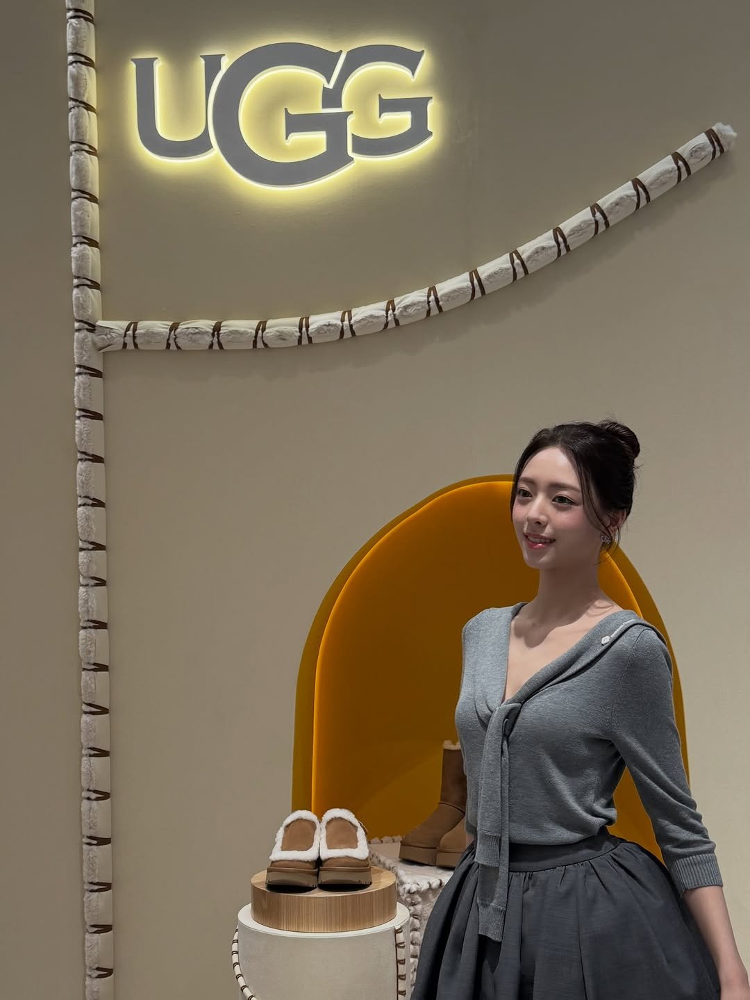 Photo shared by YUNA on October 02, 2025 tagging @ugg_korea. May be an image of 1 person, boots, slingback shoes and text.