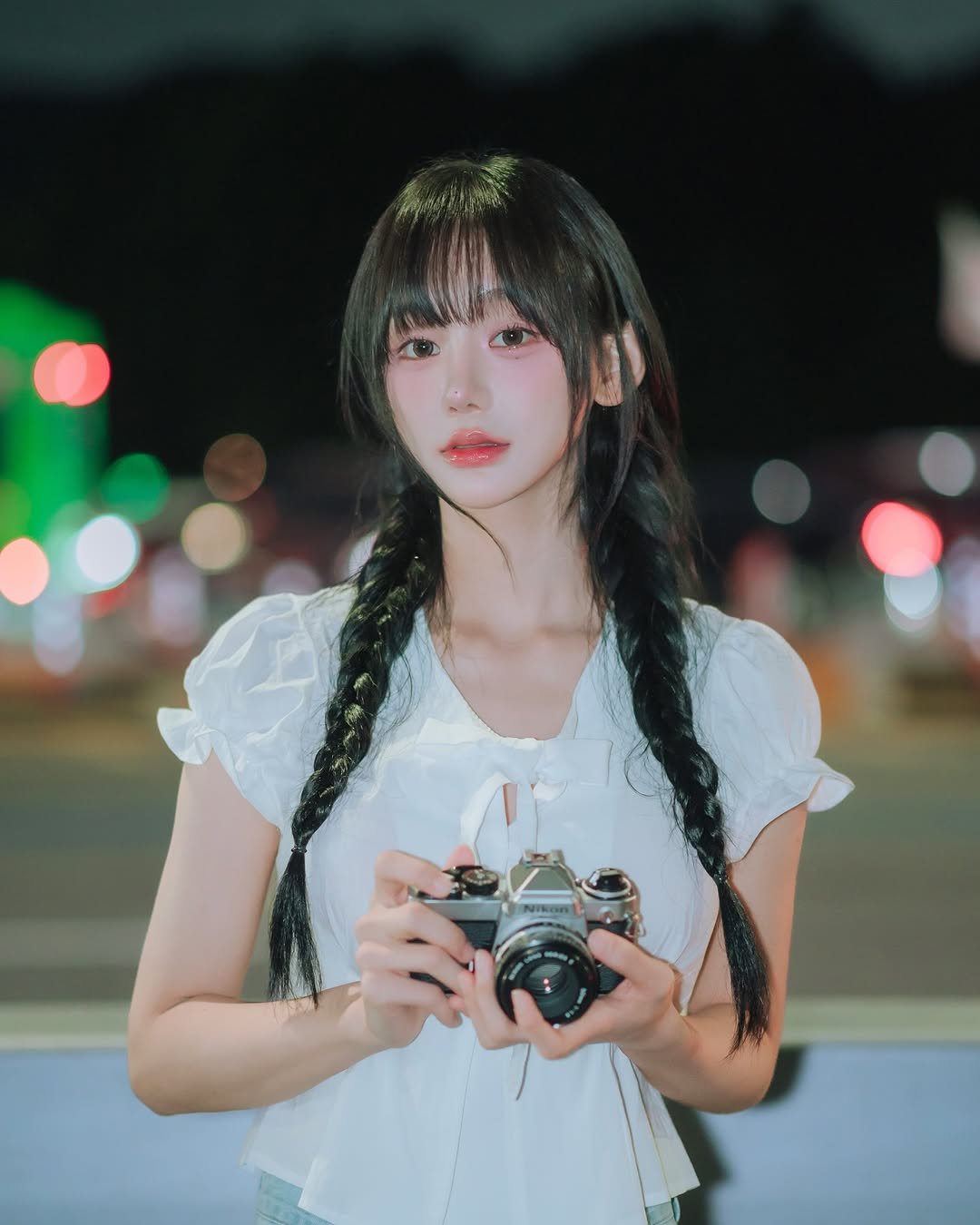 Photo shared by 오연하 on July 20, 2025 tagging @_jbright__. May be an image of 1 person, braids, makeup, dress, street and text.