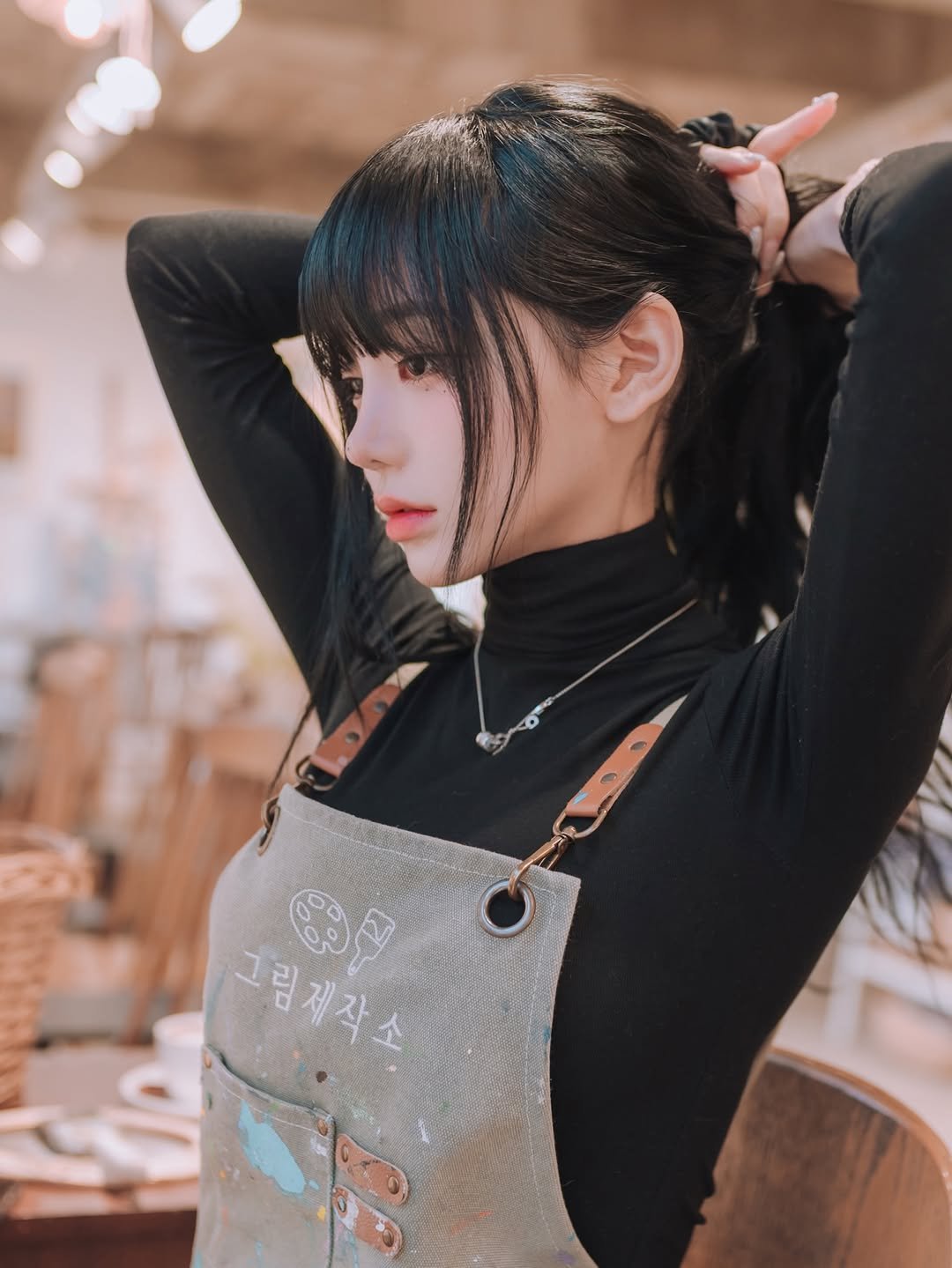 Photo shared by 제브 on January 24, 2026 tagging @ihate._.eggplant. May be an image of one or more people, hair, turtleneck, apron, top and text.