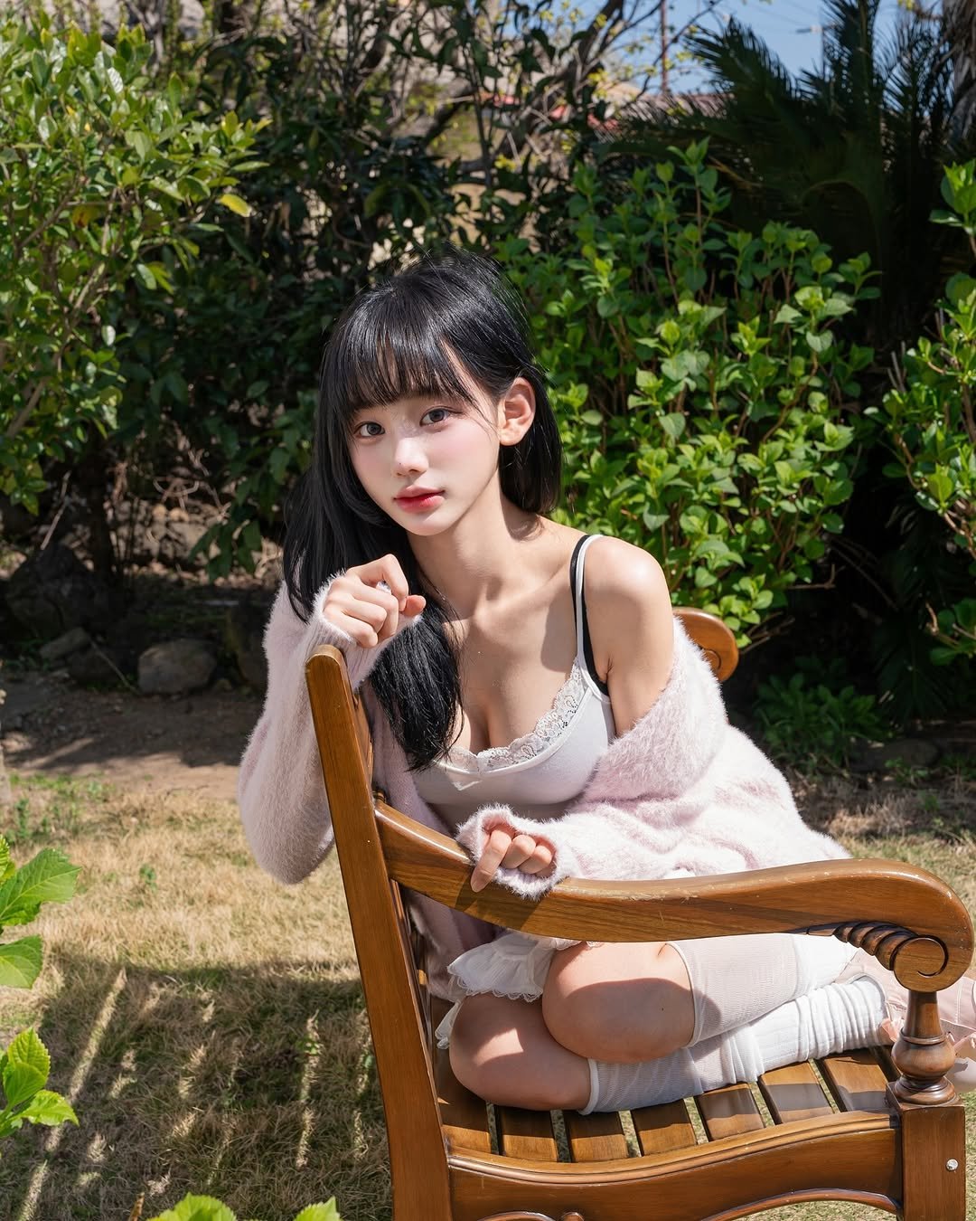 Photo shared by 오연하 on May 01, 2025 tagging @mrj2sara. May be an image of 1 person, hair, makeup, sleepwear, chaise lounge, outdoors and text.