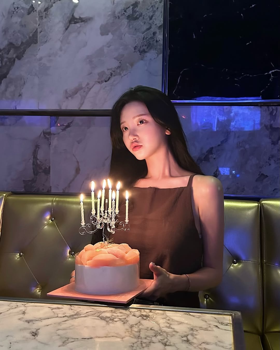 Photo by 숨니 on September 12, 2025. May be an image of 1 person, hair, cake, candle and text.