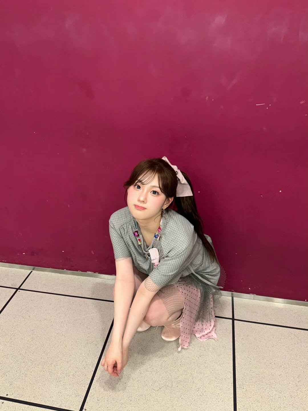 Photo by 김채현 KIM CHAEHYUN on August 23, 2025. May be an image of 1 person, hair, miniskirt and text.