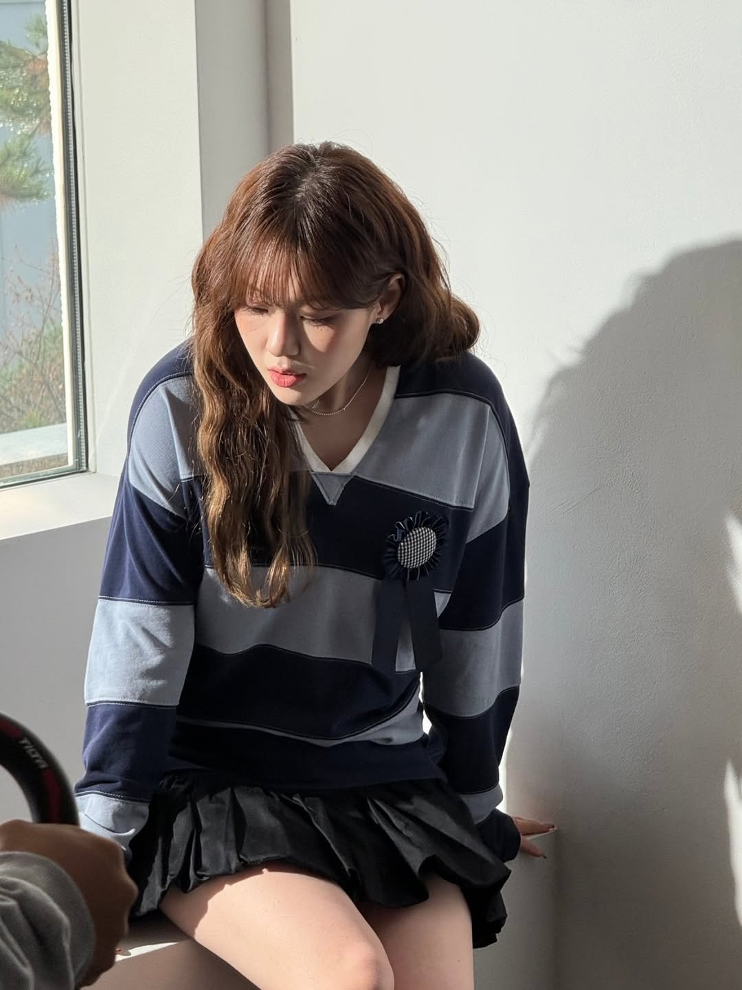 Photo by 김채현 KIM CHAEHYUN on December 11, 2025. May be an image of one or more people, hair, top and miniskirt.